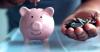 Putting coins into piggy bank retirement plan